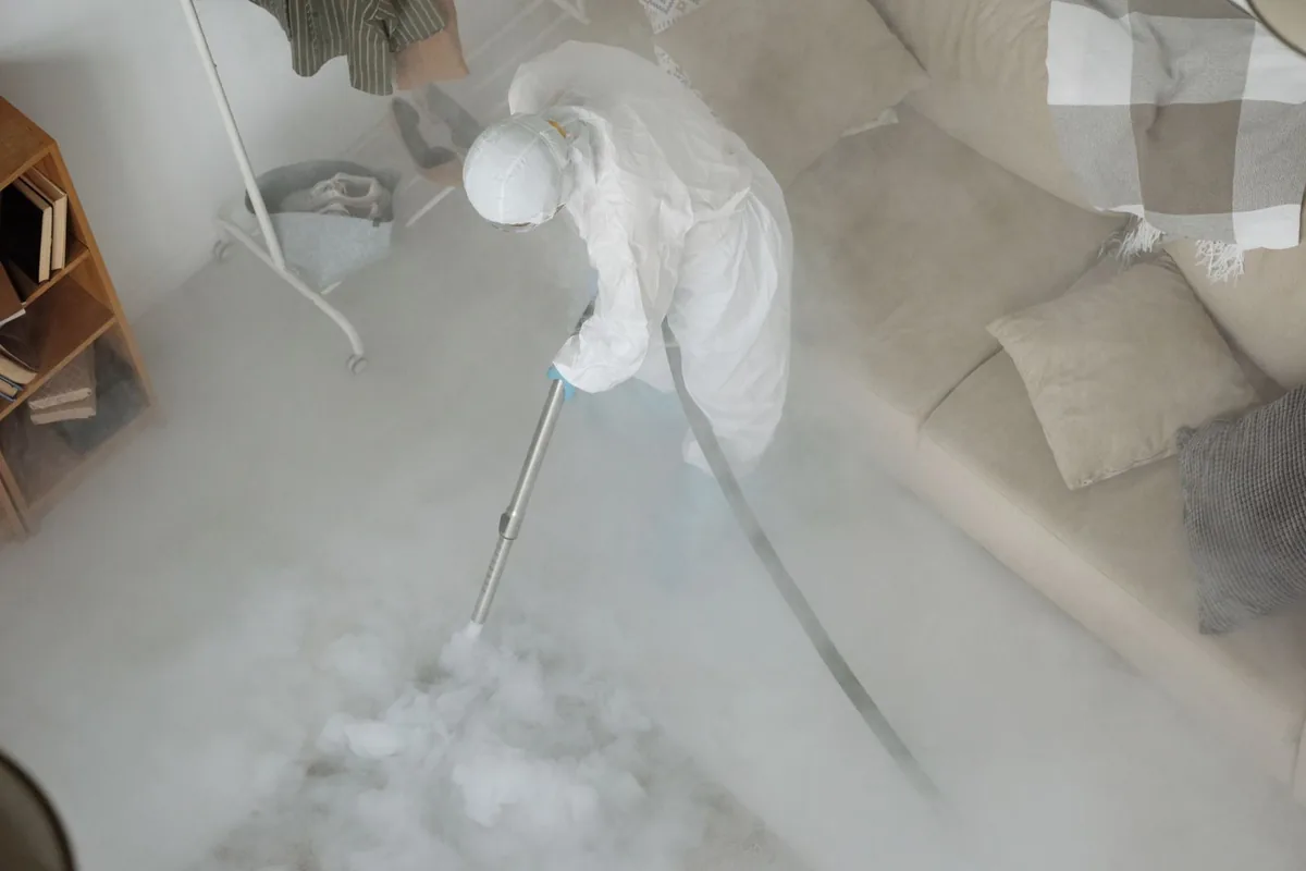 Biohazard cleanup technician in protective equipment, Jackson, MI